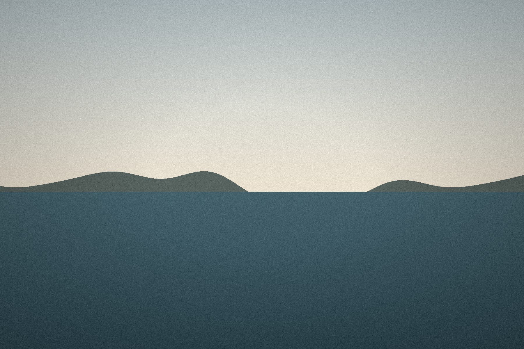 Pale sea under a hazy sky, a low ridge on the horizon.